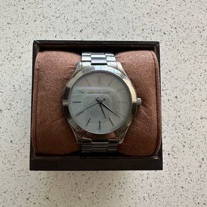 Dark blue iridescent Michael Kors watch.